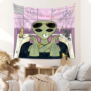 Detail of bohemian tapestry featuring street art alien illustration and vibrant print textures