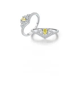Detail of s925 silver crown ring with pear-cut yellow stone and micro-paved diamonds