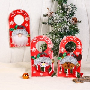 Detailed close-up of felt Christmas door hangers with Santa, Snowman and Reindeer dolls