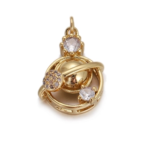 Detail of a planet-shaped gold-plated pendant featuring sparkling zircon stone settings