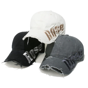 Distressed cotton baseball cap with ROSE embroidery and vintage washed torn brim detail