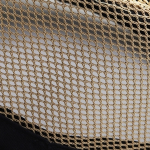 Macro view of breathable mesh material showing weave pattern and airy texture