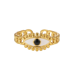 Detail of gold evil eye ring with white enamel finish and cuban link adjustable band