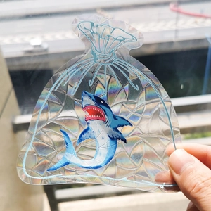 Detailed holographic shark suncatcher sticker showing rainbow prism effects on glass
