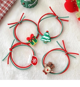 Detail of 4-piece Christmas hair tie set with resin elk, tree, and gift box charms
