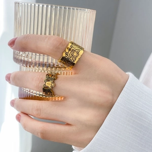Artistic gold-plated wide band rings with graffiti engraving and Keith Haring style pattern