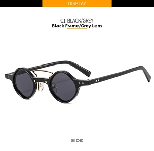 Detail view of black geometric sunglasses with dual gold metal bridge and dark grey lenses