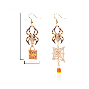 Detail of Halloween drop earrings with trick or treat text, spider and candy elements