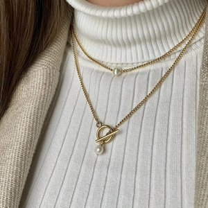 Close-up of double-layer 18K gold plated stainless steel necklace with pearls and OT toggle
