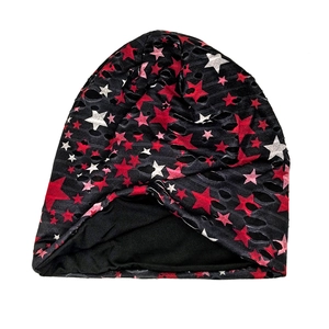 Distressed knit beanie with stars pattern and ripped hollow out aesthetic details