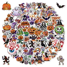 Close-up of vibrant Halloween vinyl stickers featuring pumpkins, ghosts and black cats
