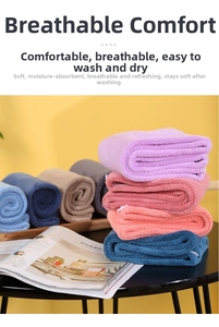 Stack of colorful thick coral fleece hair towels showing soft texture and high absorption