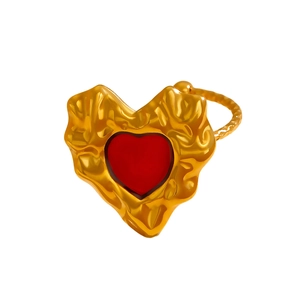 Detailed close-up of golden lava texture heart ring with vibrant red enamel inlay