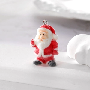 Close-up of a red flocked Santa Claus charm with soft texture and top metal ring