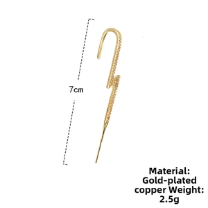 Detail shot of lightning bolt ear crawler in gold plated copper with cubic zirconia