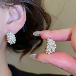 French vintage C-shaped gold hoop earrings with inlaid pearls and sparkling zircons