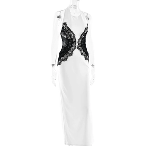 Detailed view of white halter dress with black lace side panels and sleek backless cut
