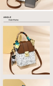 Detailed view of the cute rabbit mini handbag featuring a panda charm and silk scarf handle