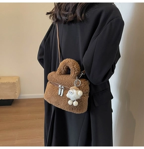 Brown faux shearling crossbody bag with silver zipper and cute white lamb charm detail