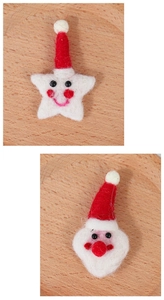 Close-up of handmade red wool felt Santa Claus and white star Christmas ornaments