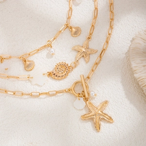 Golden multi-layer starfish and shell necklace set with pearls and OT buckle