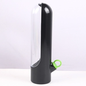 Detailed view of the black herb saver cup with green stand and clear plastic container