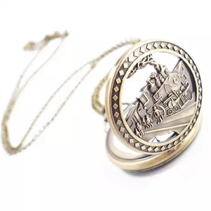 Vintage bronze pocket watch necklace featuring hollow train engine relief and quartz movement
