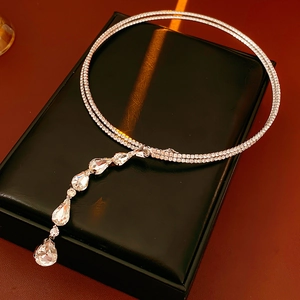 Close-up of double-layer zircon choker with waterdrop pendants on black leather display