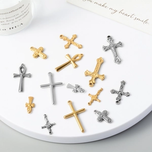 Assorted vintage stainless steel cross pendants in gold and silver for DIY jewelry
