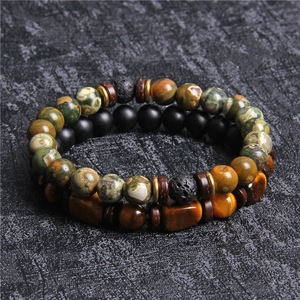 Detailed macro view of stacked natural tiger eye and lava stone beaded bracelets for men