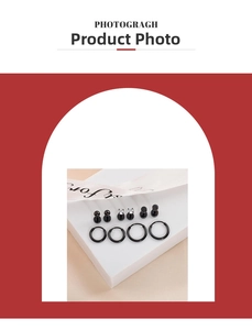 Detailed close-up of a 10-piece black stainless steel piercing set with studs and hoops