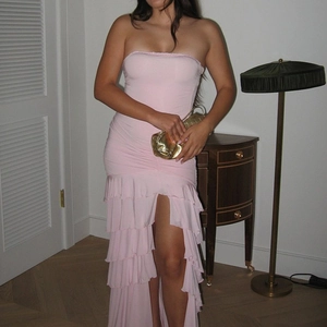 Pink off-shoulder tiered maxi dress with waist cinching and a high leg slit detail