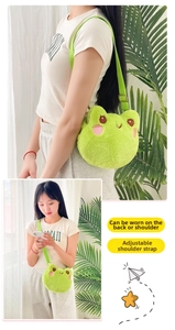 Detailed view of the adjustable shoulder strap and plush frog bag with cute embroidery