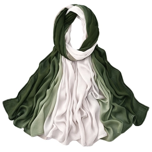 Detail view of the deep green to white gradient soft modal scarf with fine hemmed edges