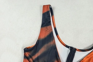 Detail of tiger print jumpsuit showing high-quality back zipper and stitched straps