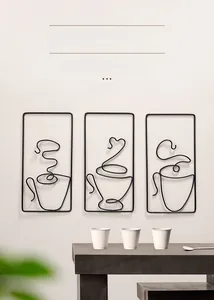 Close-up of minimalist black metal wire coffee cup wall art in three-piece set