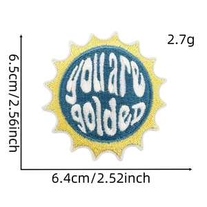 Detailed view of golden sun embroidery patch with blue border and dimensions 6.5x6.4cm