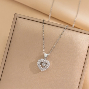 Elegant silver heart necklace with double-layered sparkling rhinestones on jewelry box