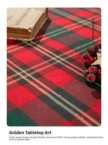 Macro view of Christmas table runner with red and green plaid and gold wire weave