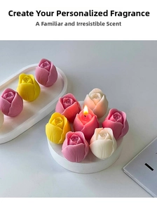 Detailed view of handmade tulip and rose scented candles in various pastel colors