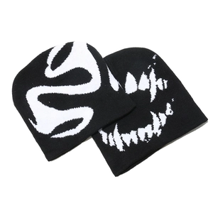 Streetwear black knit beanie with white abstract pattern, unisex winter warm skull cap.