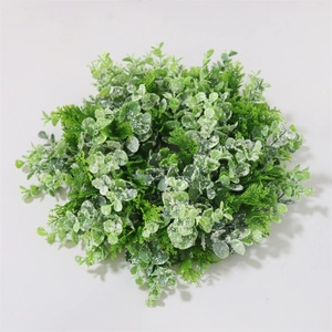 Detail of artificial eucalyptus and fern wreath with frosted finish for home wall decor