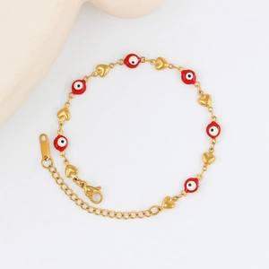 Detailed view of the lobster clasp and adjustable extension chain on the gold heart bracelet