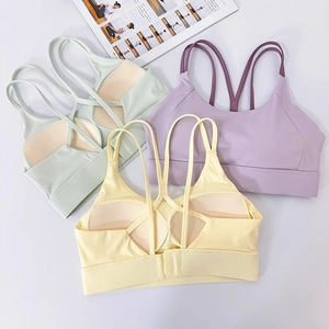 Detail of high-impact sports bras showing cross-back straps and honeycomb breathable pads