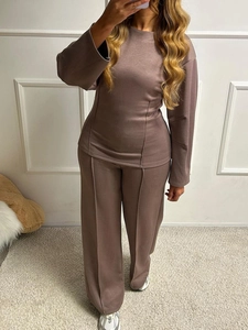 Close-up of brown long sleeve top and wide leg trousers set with soft elastic fabric