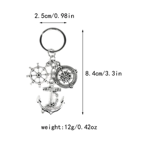 Detailed view of vintage silver nautical keychain showing 8.4cm length and rudder charms
