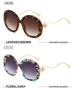 Side view of retro sunglasses with gold wave temples and pearl details in floral patterns