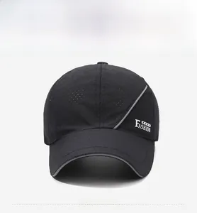 Detail of breathable black mesh fabric and white FASHION lettering on sport cap