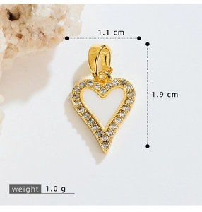 Macro shot of 1.1cm heart pendant with white enamel center and sparkling crystal trim