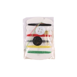 Portable mini sewing kit including six thread colors, needles and buttons on white background